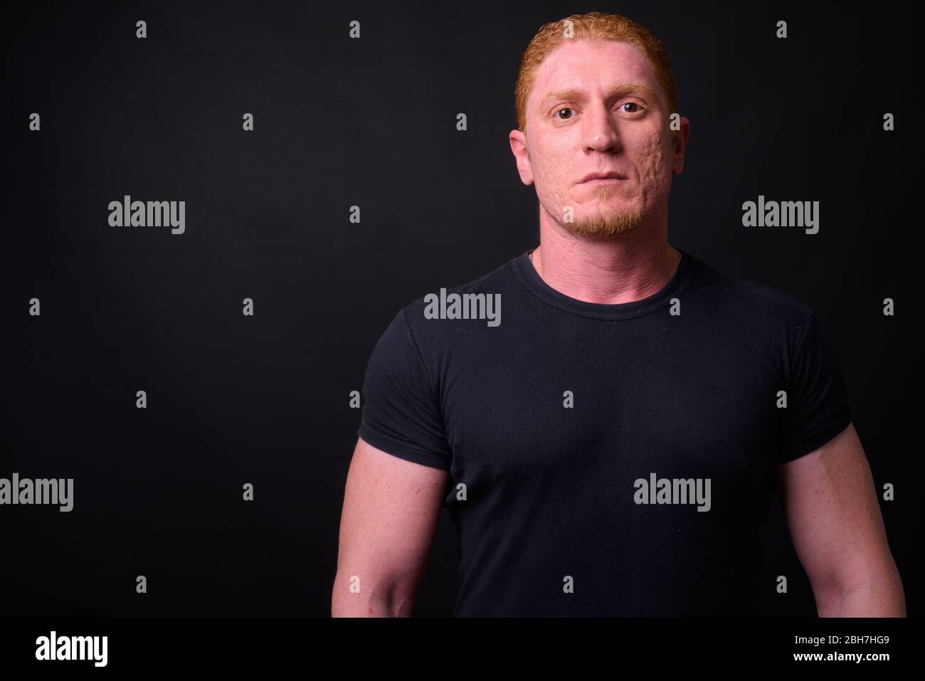 Portrait of muscular man with orange hair Stock Photo