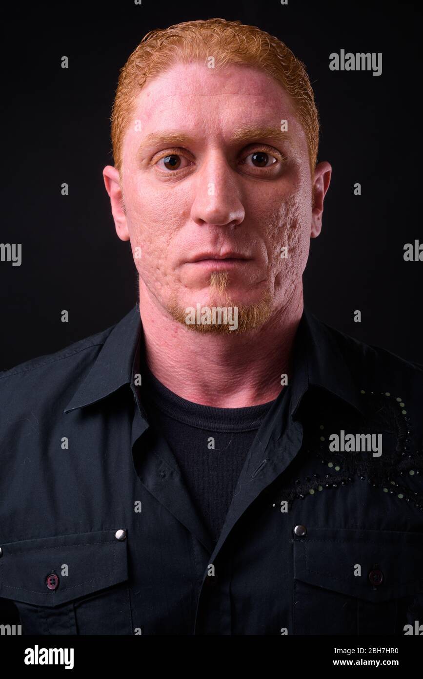 Face of muscular man with orange hair Stock Photo