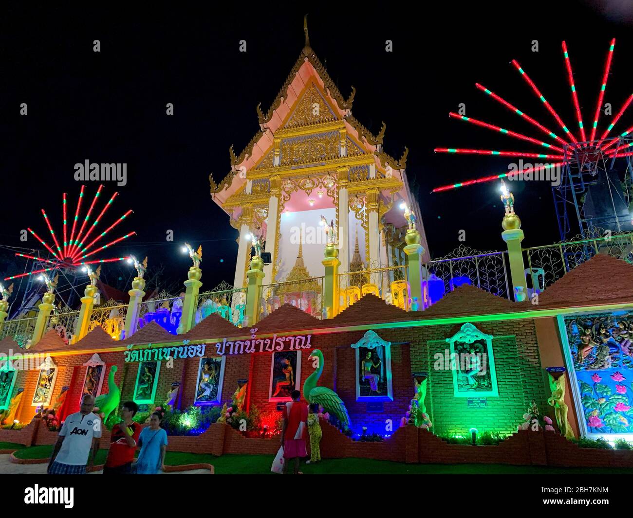Photo of Night festival of Thai temple with colorful neon lamp on Makha Bucha Day Pranburi Thailand February 21, 2019 Stock Photo