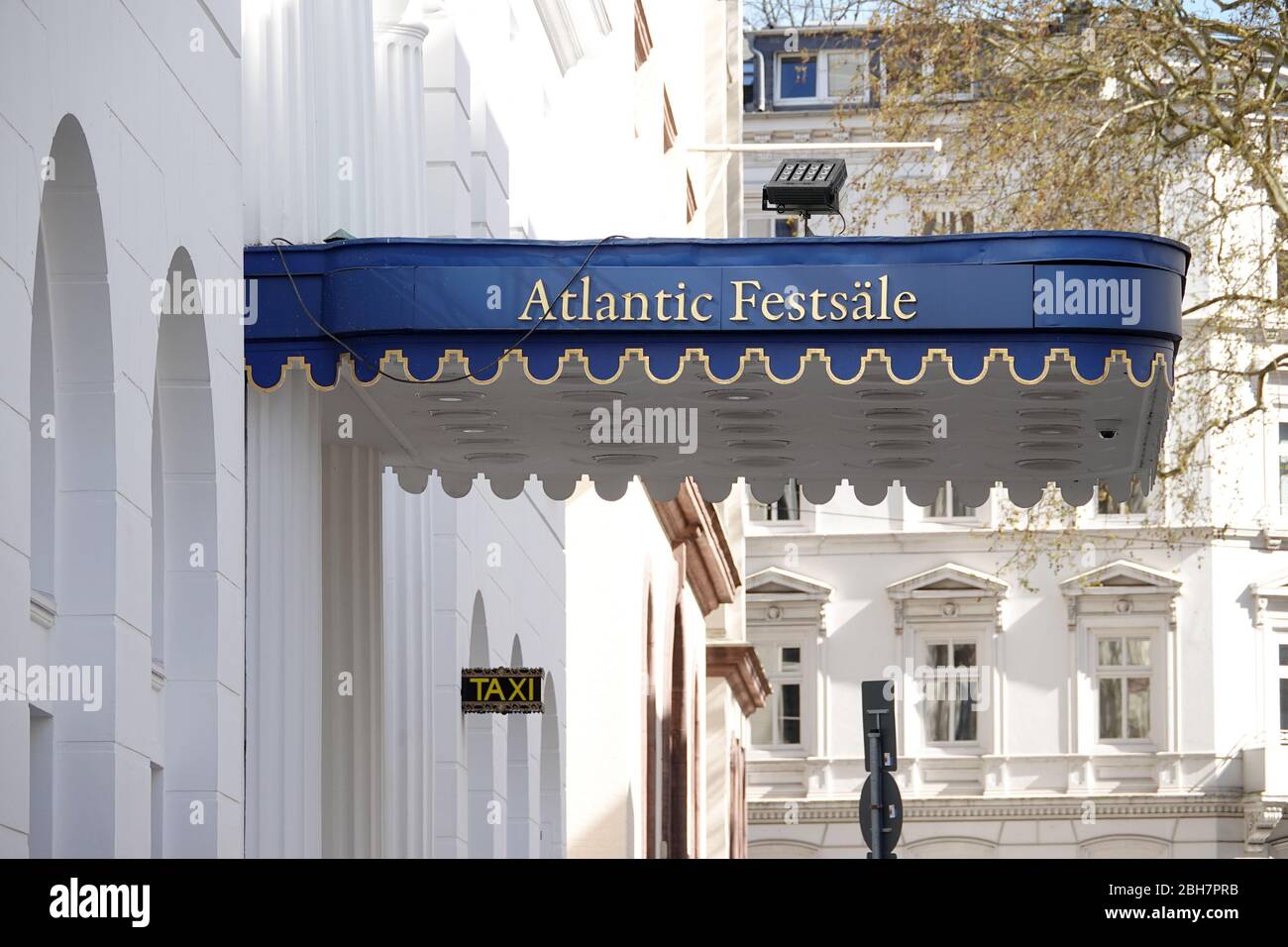 Hamburg, Germany. 22nd Apr, 2020. A sign with the lettering 'Atlantic Festsäle' can be seen at the closed Hotel Atlantic Kempinski, one of Hamburg's leading hotels. The hotel is currently scaffolded due to construction work. The hotels of the Hanseatic city are closed for tourist operations due to the Corona crisis. Credit: Bodo Marks/dpa/Alamy Live News Stock Photo