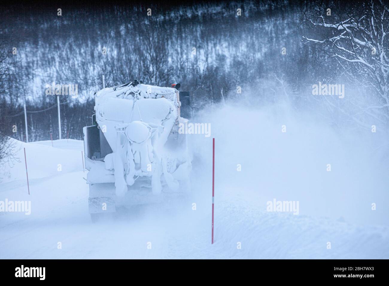 snowplow in action on a icy road in northern Norway near Tromsoe Stock