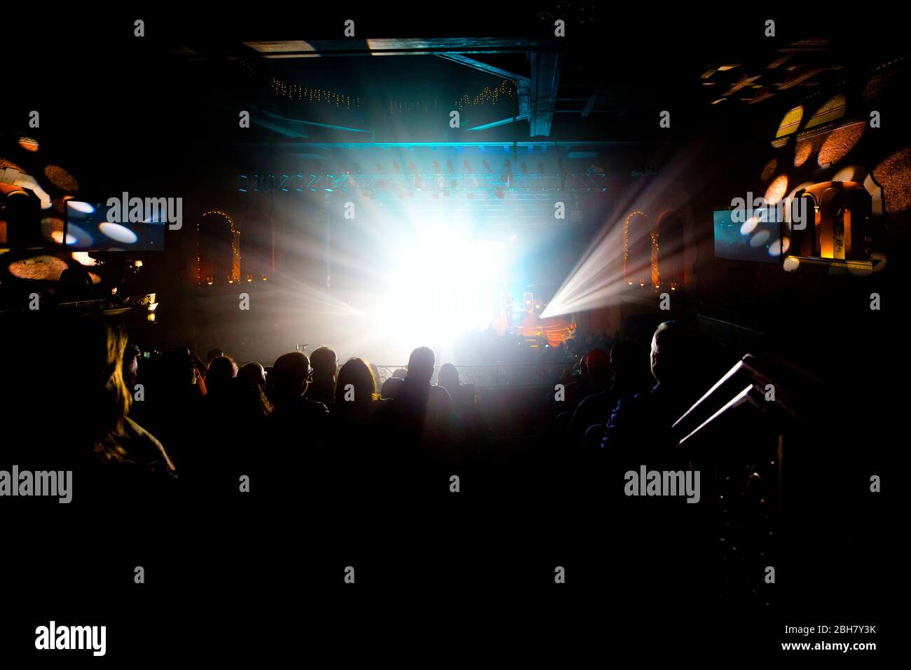 Stage Light Show Inside of a Live Local Concert Venue Surrounded by a