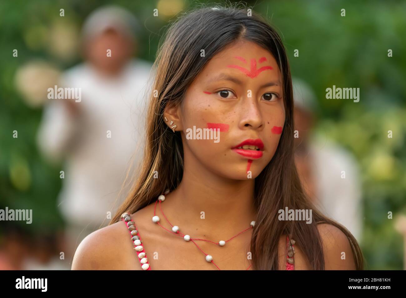 Peruvian girls dressed in traditional celebratory garb meet visitors with  music and dancing in the Peruvian Amazon Stock Photo - Alamy