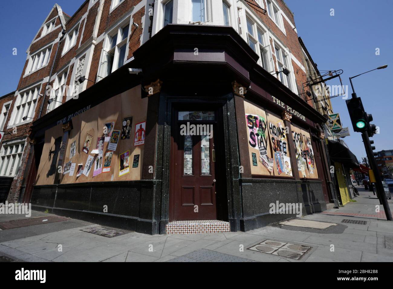 Homerton, London, UK. 24th Apr 2020. The boarded up Homerton pub in East London, calling people to stay home and safe. Due to the Covid-19 outbreak. Credit: Marcin Nowak/Alamy Live News Stock Photo