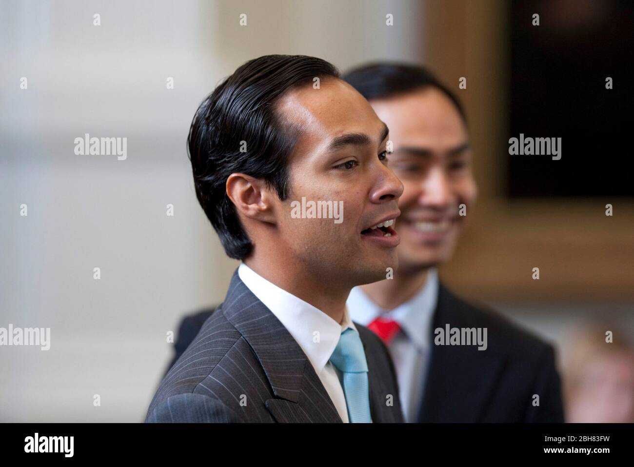 Austin Texas USA, May 27, 2009: Newly-elected mayor of San Antonio, Julian Castro, visits with legislators at the Texas Capitol following his spring election victory. Castro's identical twin brother, Joaquin (background), is a state representative from San Antonio. ©Bob Daemmrich Stock Photo