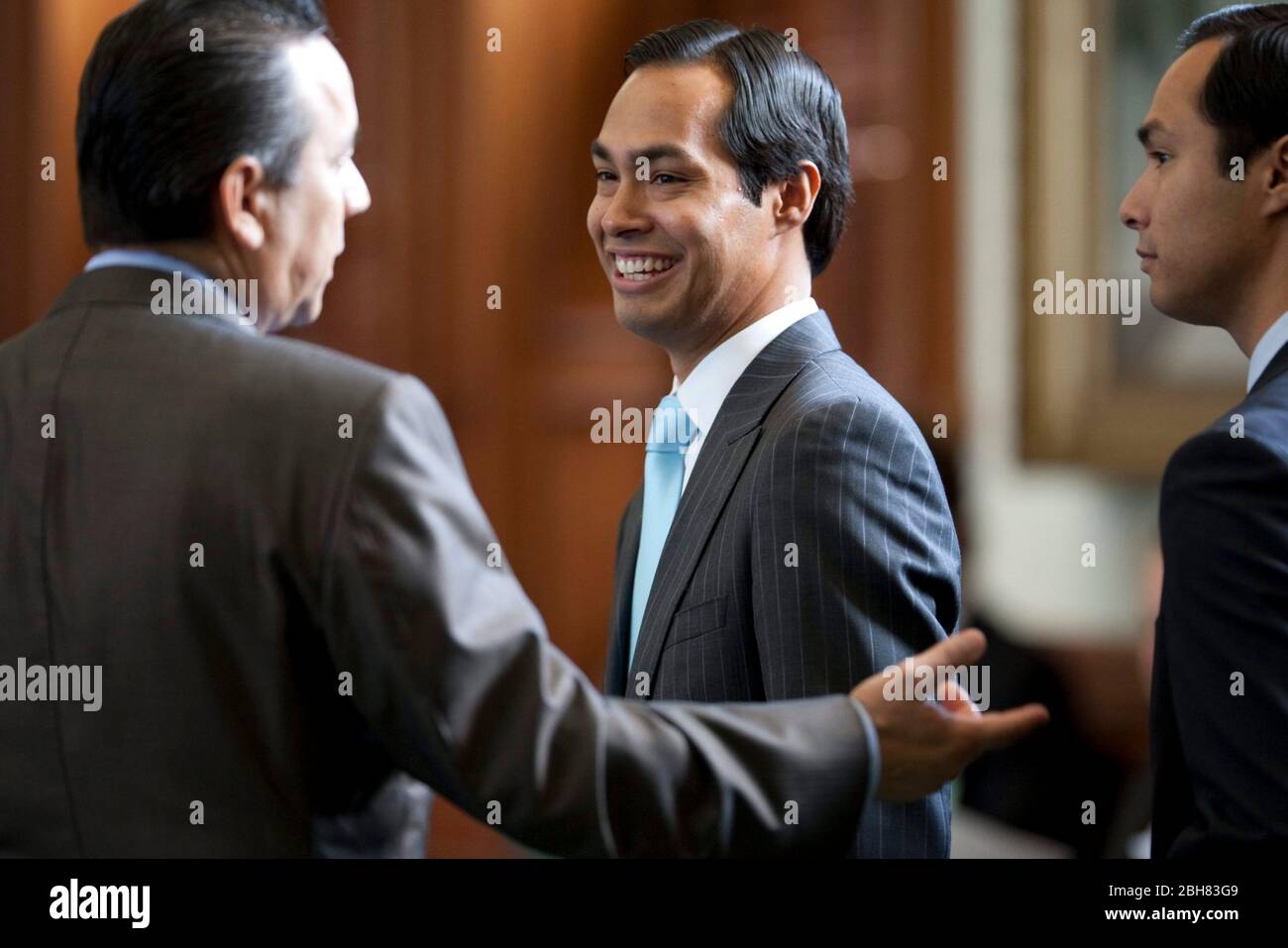 Austin Texas USA, May 27, 2009: Newly-elected mayor of San Antonio, Julian Castro, visits with legislators at the Texas Capitol following his spring election victory. Castro's identical twin brother, Joaquin (right), is a state representative from San Antonio. ©Bob Daemmrich Stock Photo