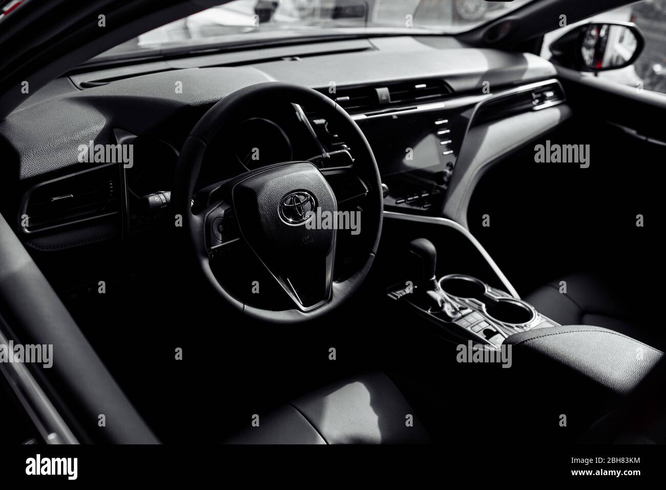 RIVNE, UKRAINE OCTOBER 27, 2019 Toyota luxury new car Interior steering wheel, driver