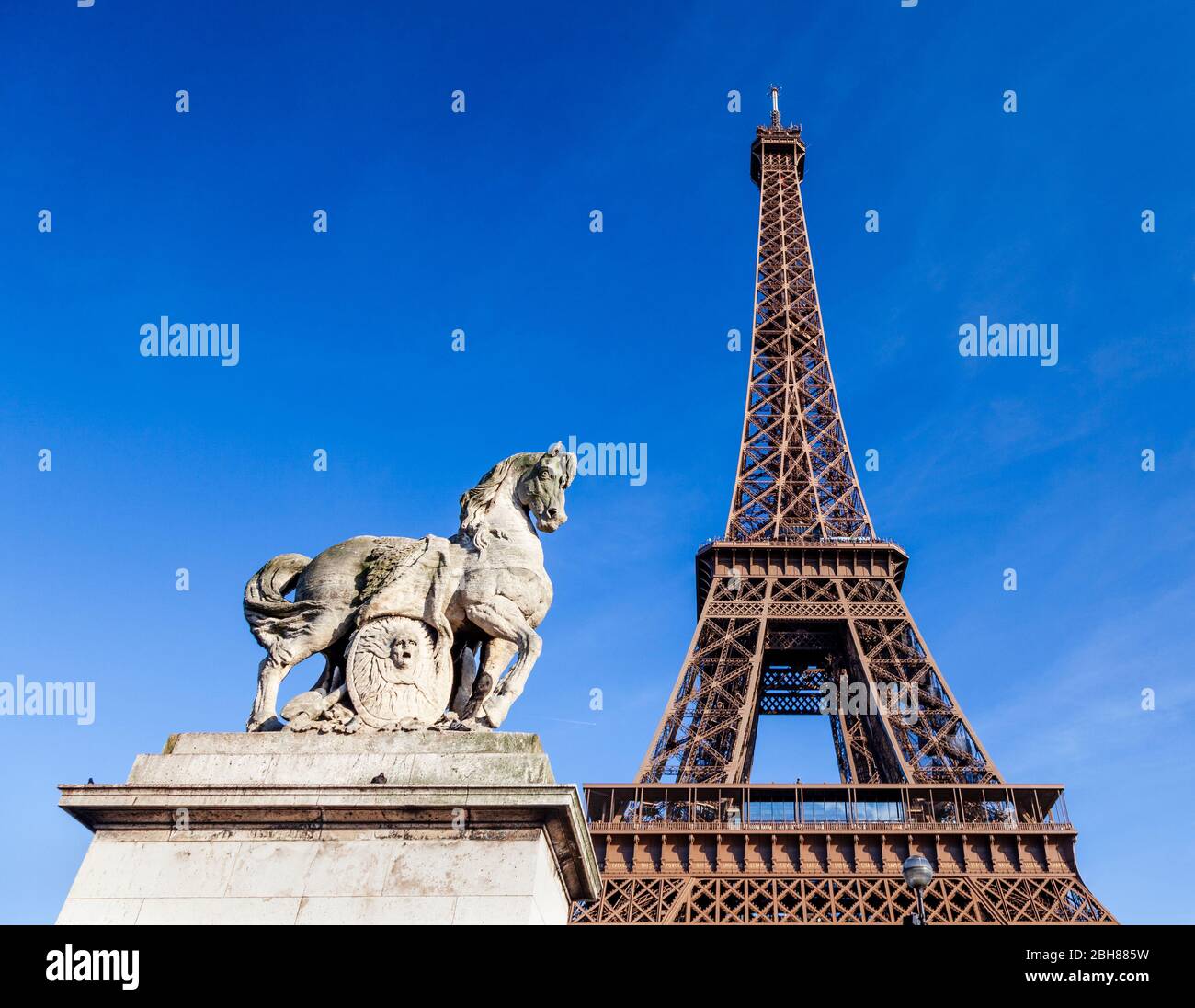 The Gallic warrior sculpture by Antoine-Augustin Préault on the Pont d'Iéna with the Eiffel Tower in the background, Paris Stock Photo