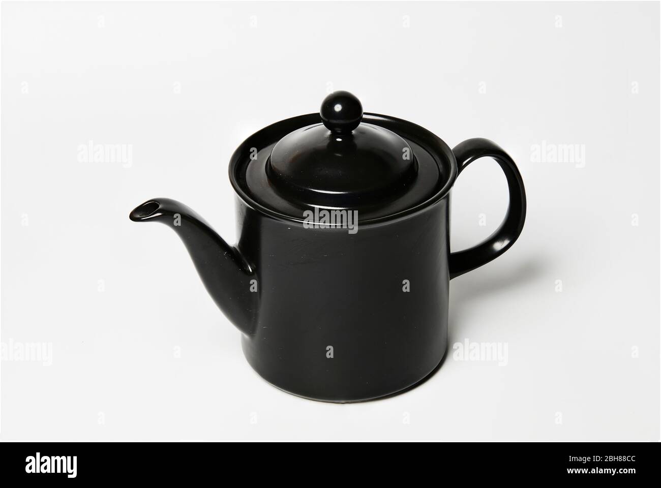 still life of a beautiful black coffee pot on white background Stock Photo