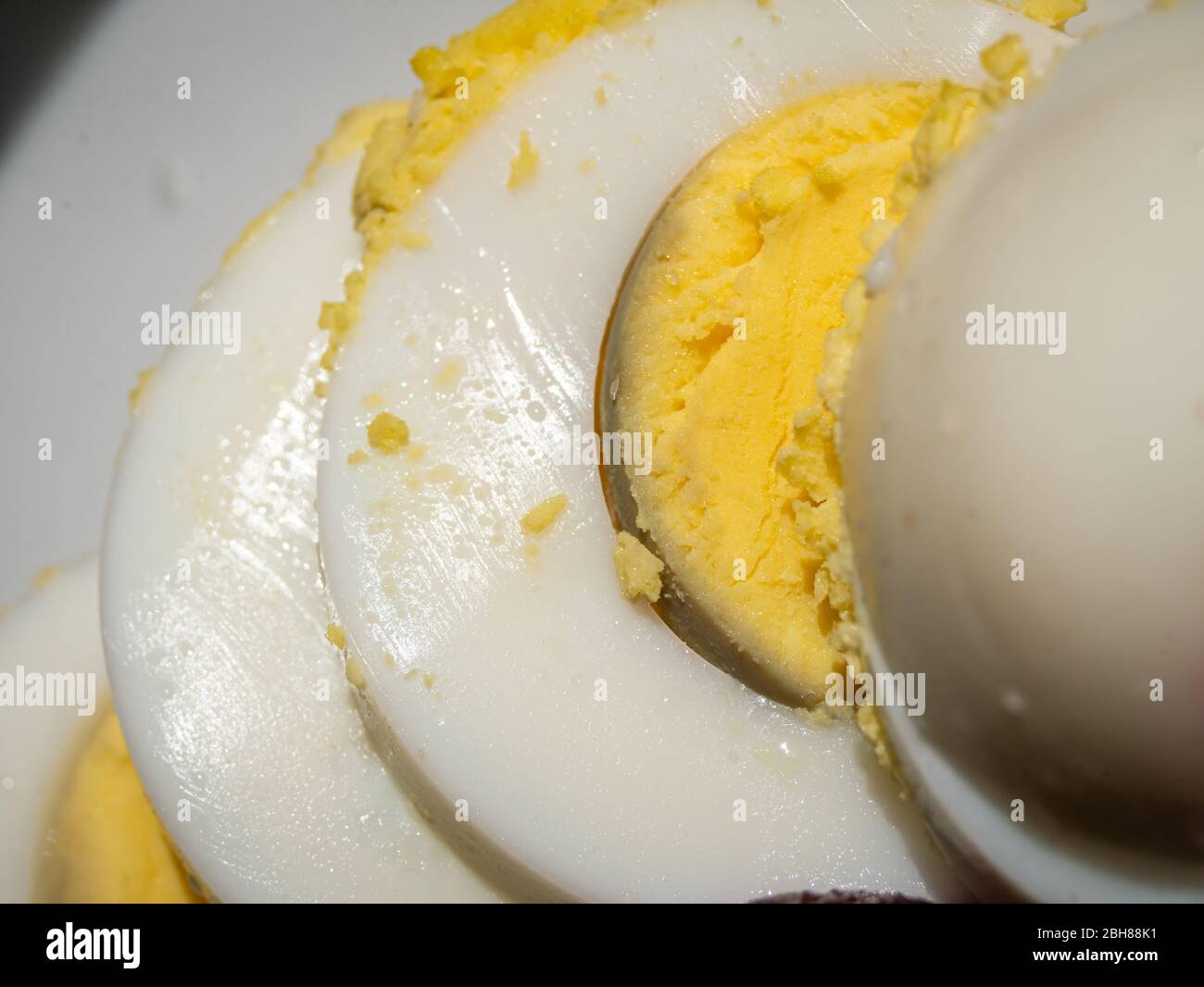Sliced boiled egg on a summer salad Stock Photo