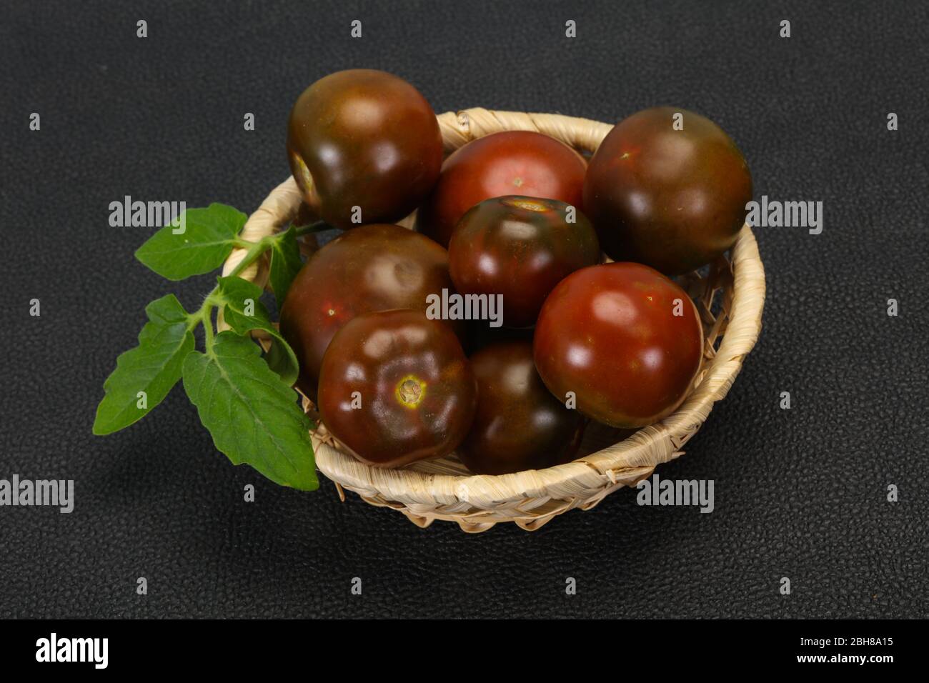 Black tomato tasty fresh ripe Kumato Stock Photo Alamy