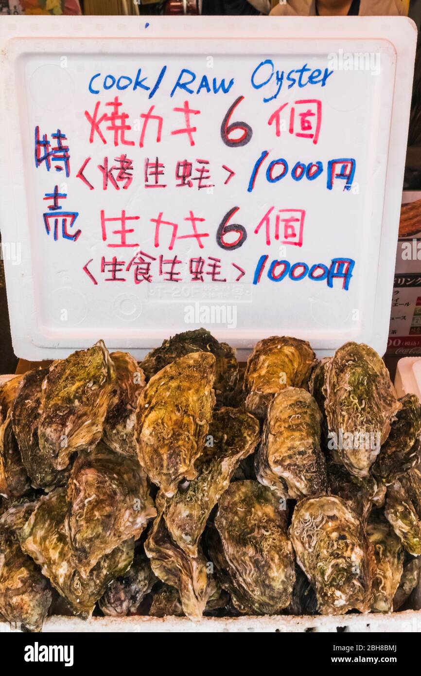 Japan, Honshu, Tokyo, Ueno, Ameyoko Shopping Street, Typical Open Air Fast Food Restaurant, Display of Fresh Oysters Stock Photo