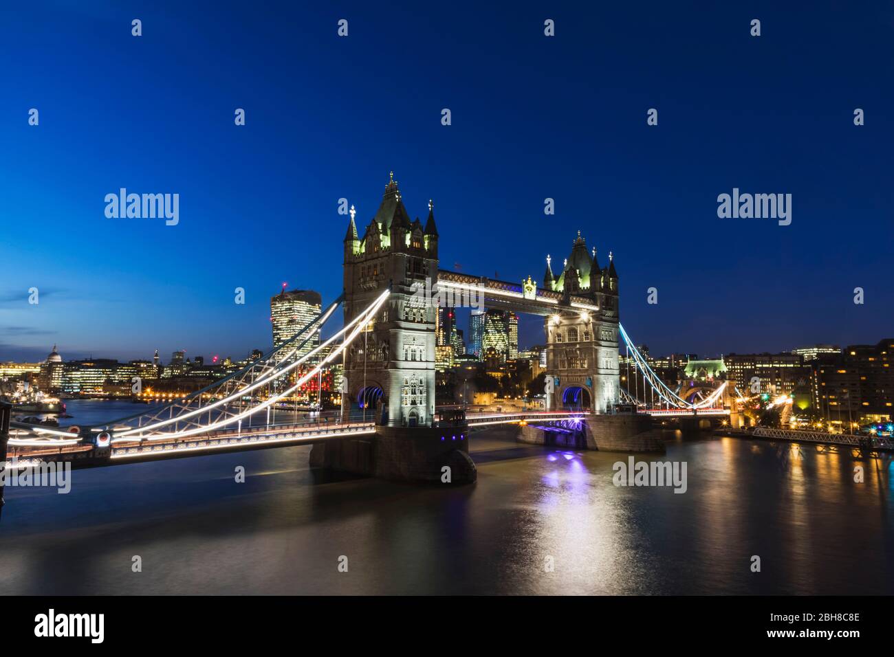 England, London, Night View of Tower Bridge and The City of London Skyline Stock Photo