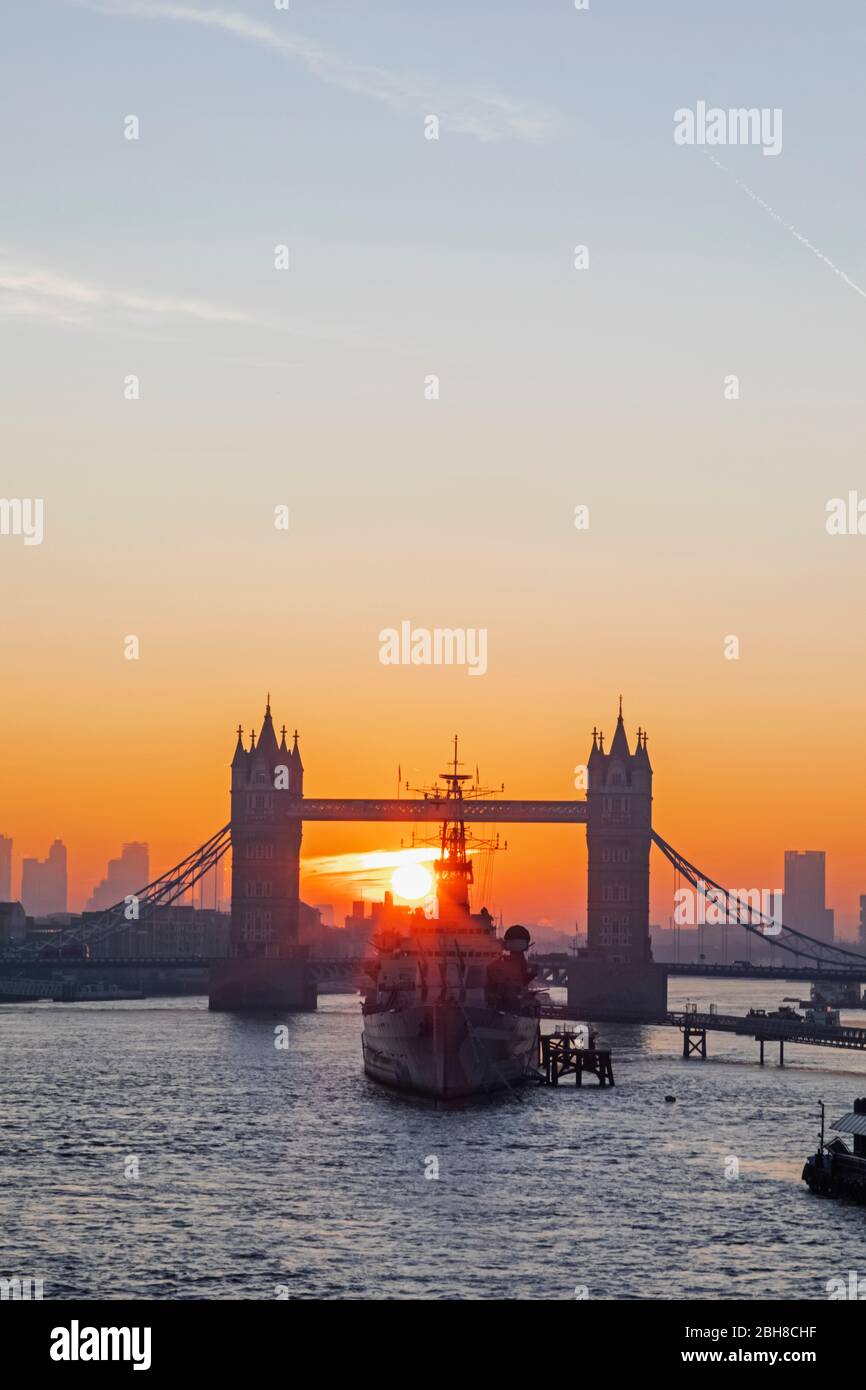 England, London, Tower Bridge and Museum Ship HMS Belfast at Sunrise Stock Photo