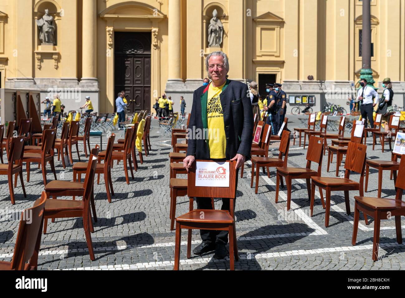 Munich. 24th Apr, 2020. Munich 24. April 2020 | An employee of the renowned restaurant 'Blauer Bock' at a rally to support the gastronomy. The catering trade is particularly hard hit by the restrictions on going out and the ban on contact. Credit: Thomas Vonier/ZUMA Wire/Alamy Live News Stock Photo