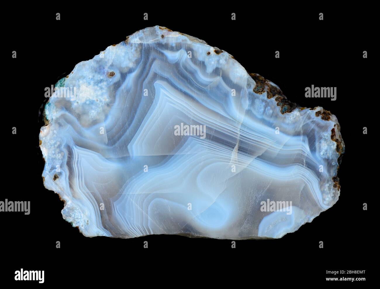 Slice of blue agate geodes with concentric layers, isolated on a black background Stock Photo