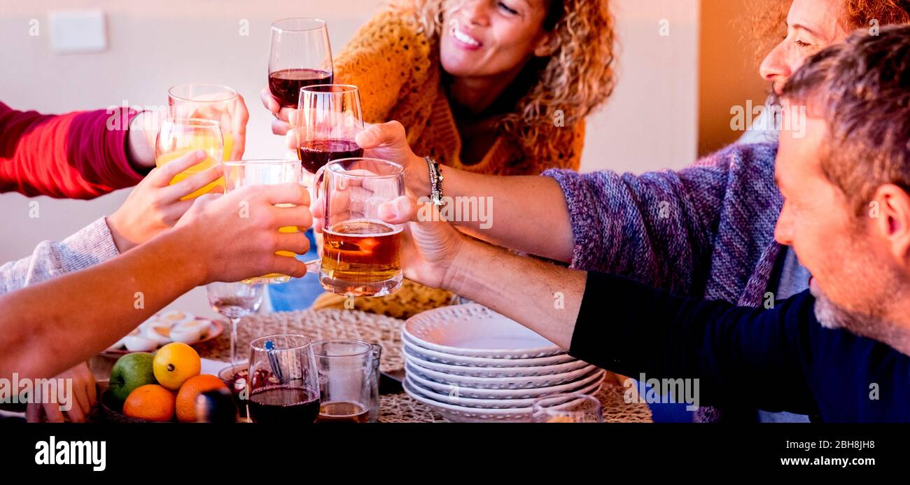 Group of caucasian people friends cheering with glasses of beer and