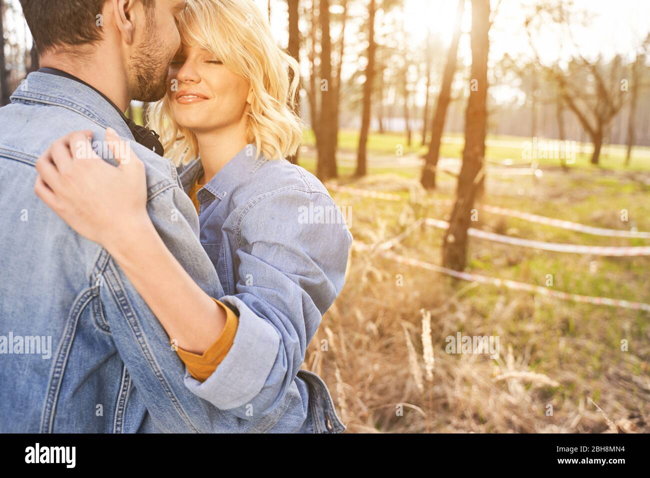 Two loving people hugging each other outside Stock Photo - Alamy