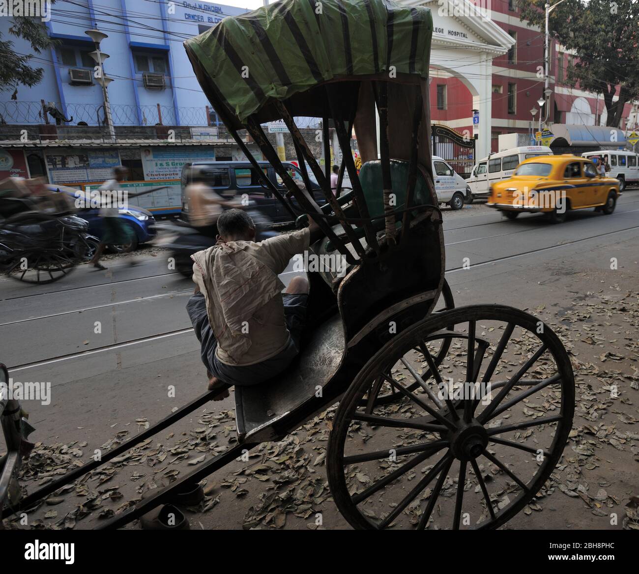 Hand Rickshaw Puller waiting for customers in Kolkata, West Bengal