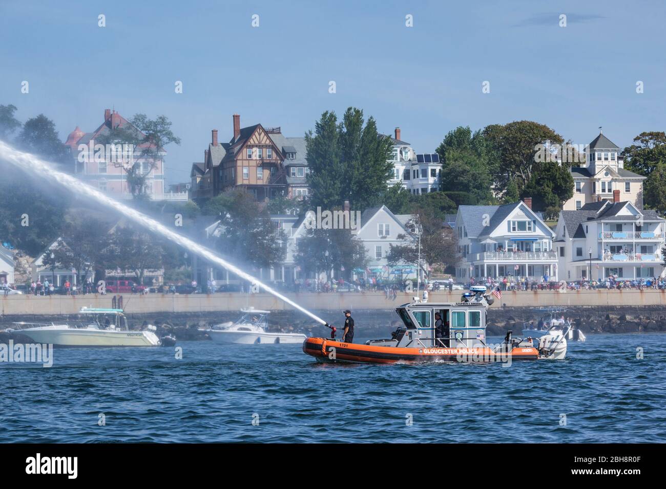 USA, New England, Massachusetts, Cape Ann, Gloucester, Gloucester Schooner Festival, fireboat welcome salute with water cannon Stock Photo