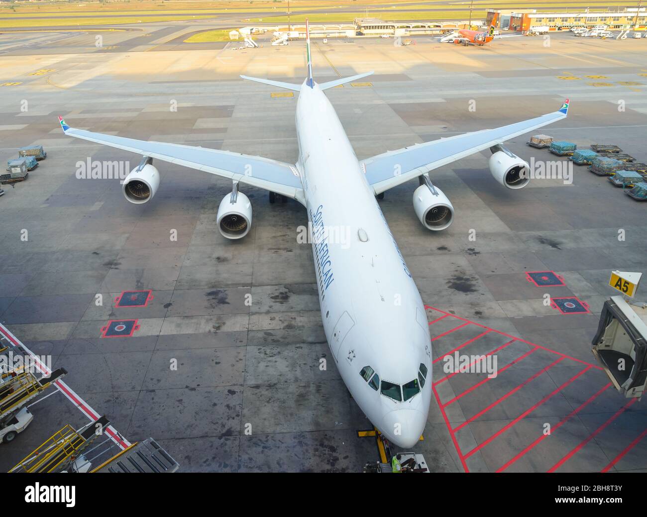 South African Airways Airbus A340 at O. R. Tambo International Airport in South Africa. Long A340-600 jet registered as ZS-SNE. Stock Photo