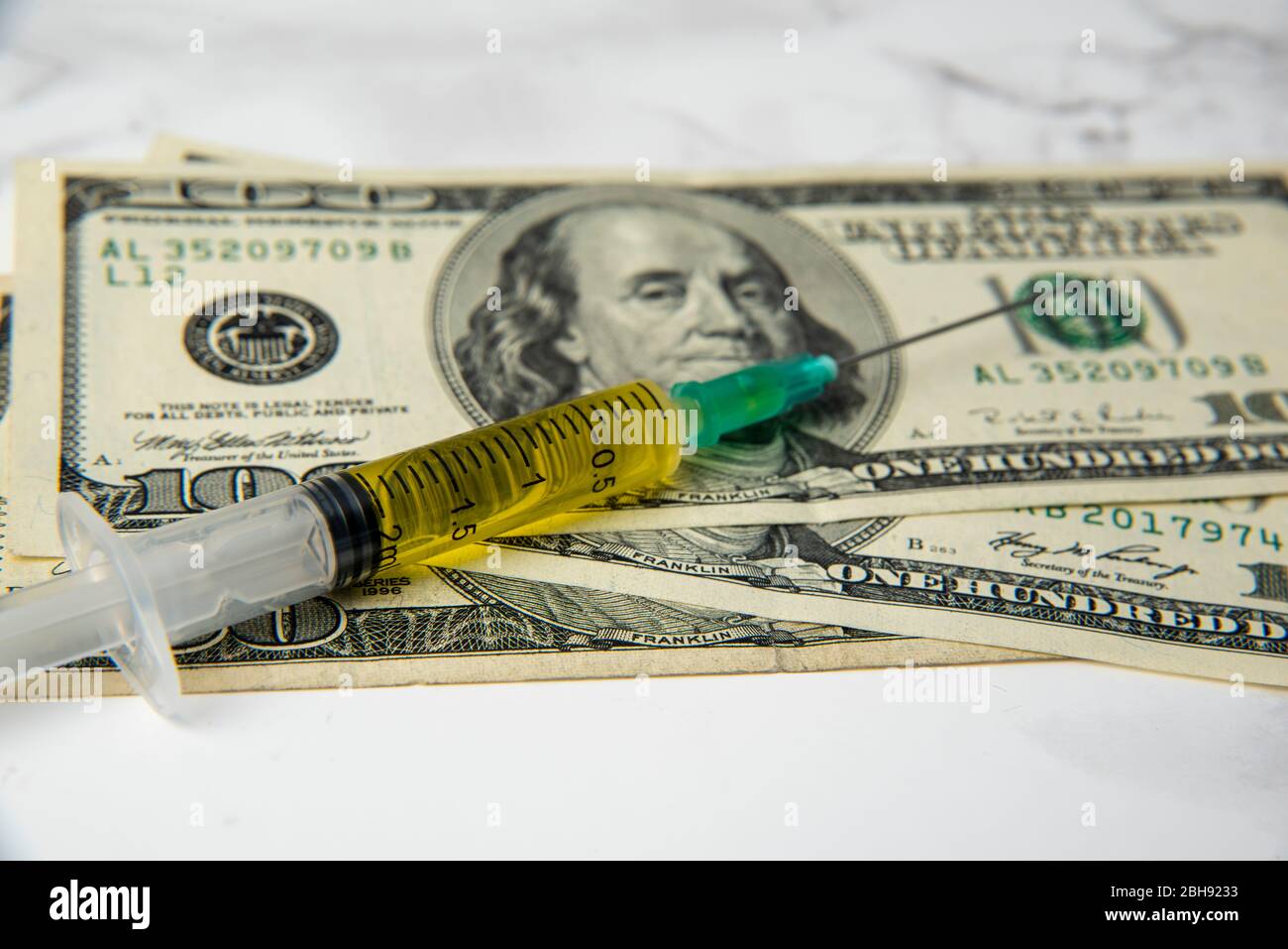 coronavirus vaccine on dollars. corona economic Stock Photo