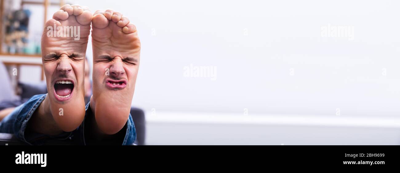 Funny Facial Expression On Smelly Feet With Pain Stock Photo