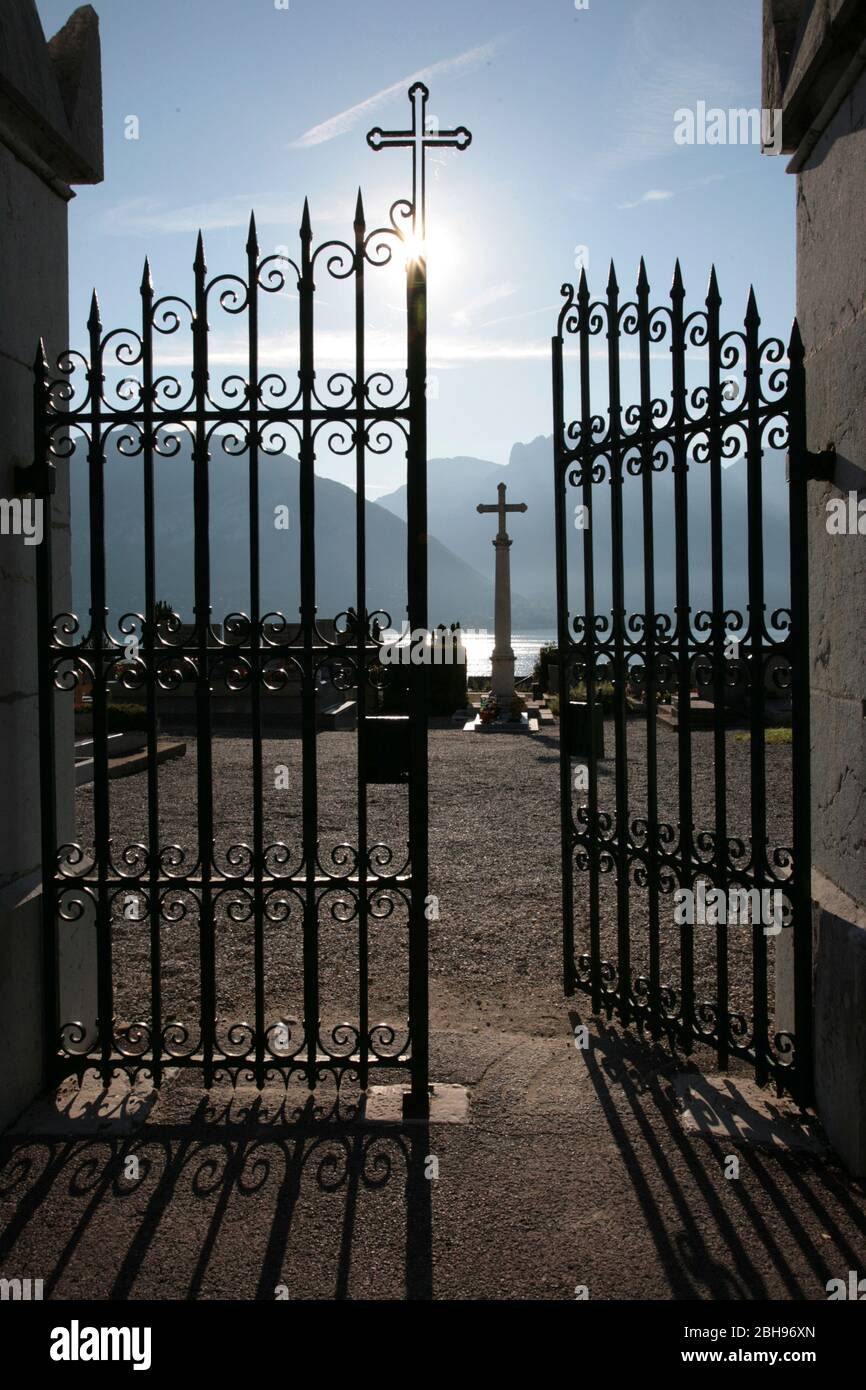 Lake Annecy, lake of Annecy, Haute-Savoie, France, open gate with view of the cross, lake and mountains Stock Photo