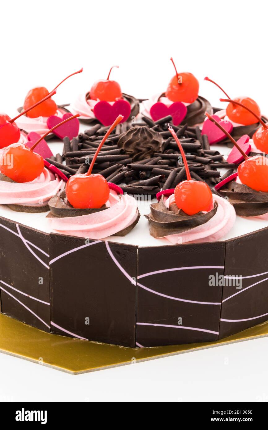 Chocolate cake with cherry on top Stock Photo