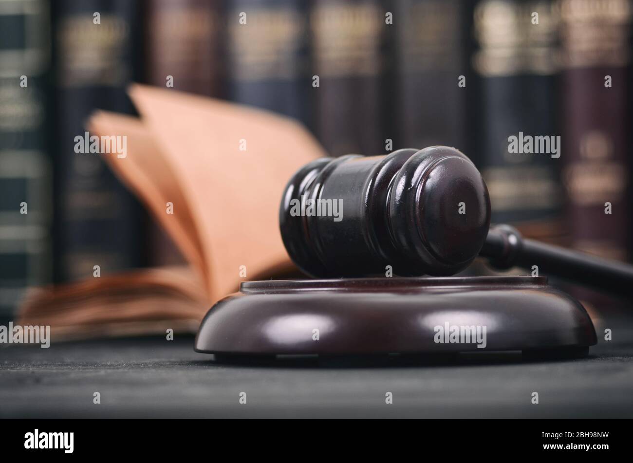 Law and Justice , Legality concept, Judge Gavel and law book on a black wooden background, law library concept. Stock Photo