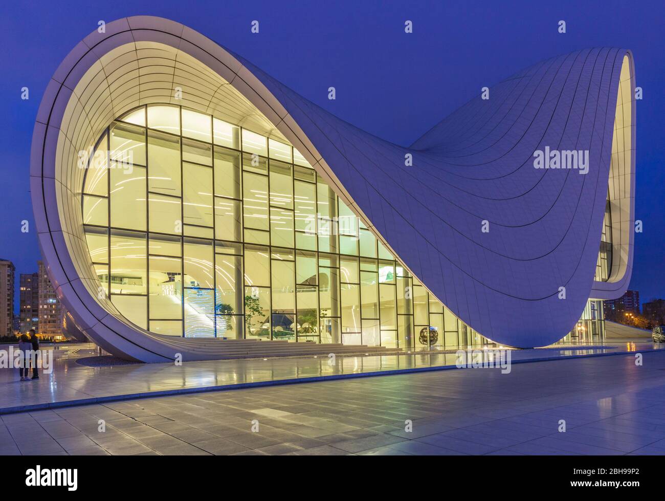 Azerbaijan, Baku, Heydar Aliyev Cultural Center, building designed by Zaha Hadid, exterior, dusk Stock Photo