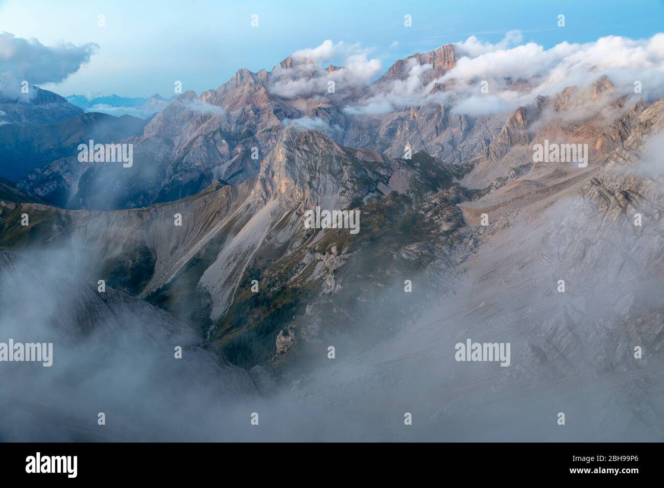 A cloudy dusk on Marmolada group seen from the summit of Cima di Costabella, Costabella Ridge, Marmolada group, Dolomites, Fassa Valley, Trento province, Trentino-Alto Adige, Italy Stock Photo