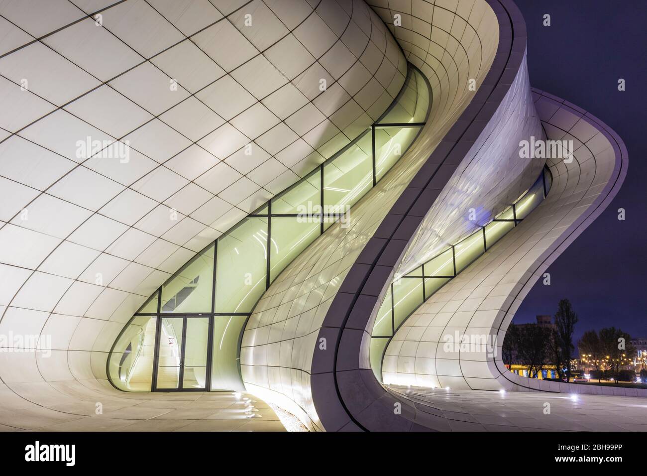 Azerbaijan, Baku, Heydar Aliyev Cultural Center, building designed by Zaha Hadid, exterior, dusk Stock Photo