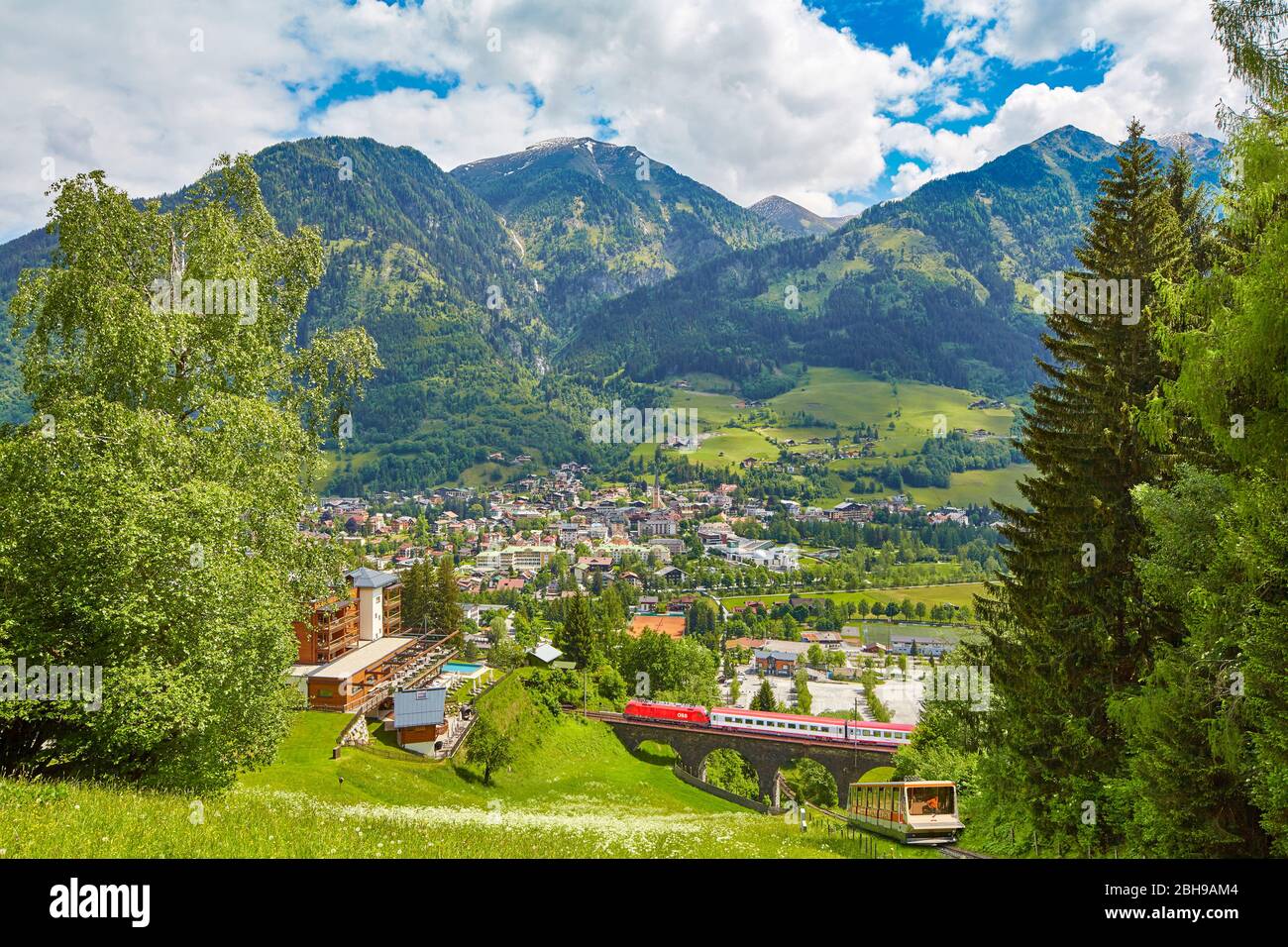 View over the spa town of Bad Hofgastein from the Pyrkerhöhe, in the foreground the Tauernbahn and the Schlossalmbahn (railroads) Stock Photo