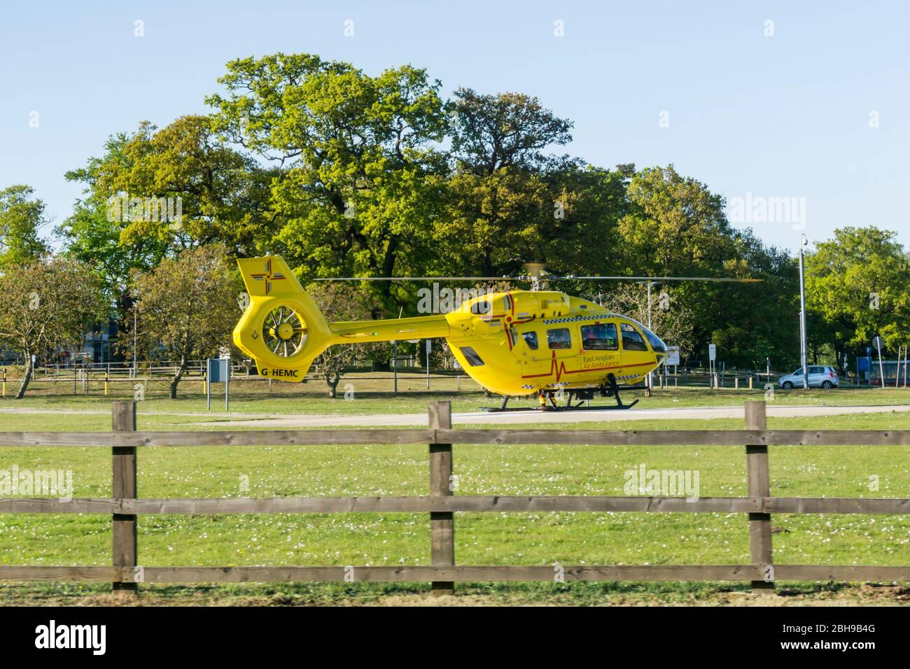 24 April 2020. King's Lynn, Norfolk, UK.  The East Anglian Air Ambulance helicopter G-HEMC, code name Anglia Two, on the ground at the Queen Elizabeth Hospital, King's Lynn.  Credit: UrbanImages-News/Alamy Stock Photo