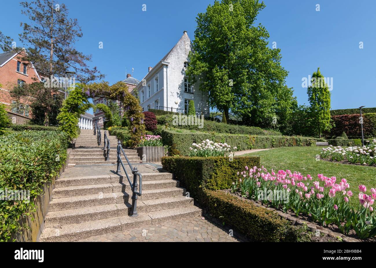 Public park with stairs and a beautiful landscaped spring garden. Stock Photo