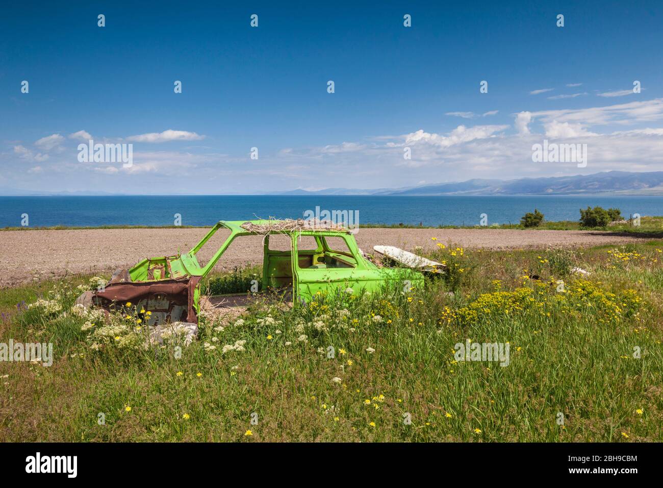 Armenia, Lake Sevan, Artsvanist, high angle view of Lake Sevan with abandoned car Stock Photo