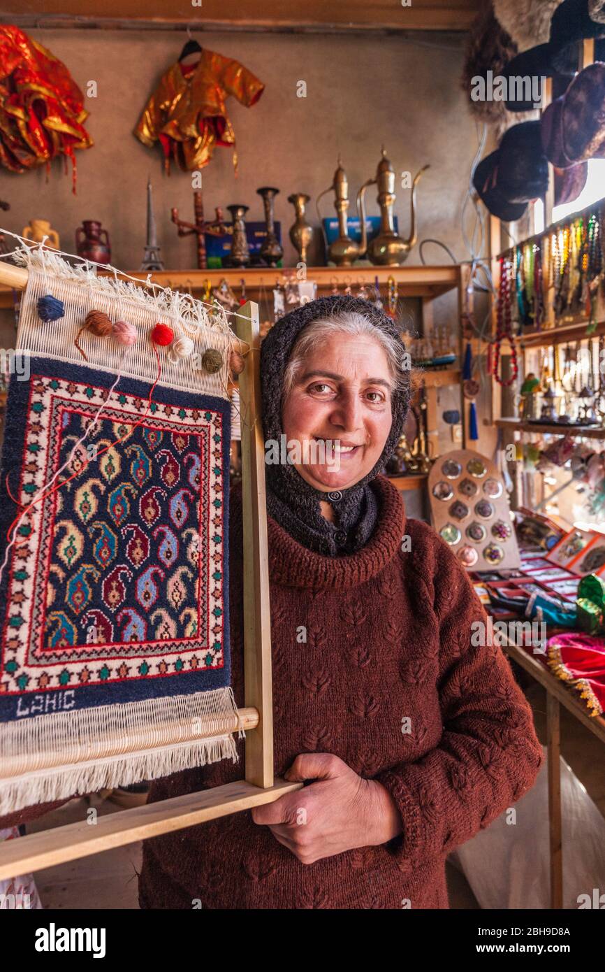 Azerbaijan, Lahic, female shopkeeper in shop, Stock Photo