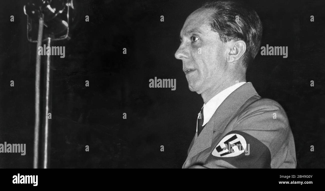 German Minister of Culture Joseph Goebbels sitting outside in garden of Carlton Hotel during the occasion of League of Nations meeting Stock Photo