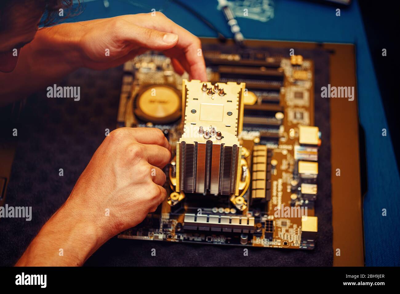 Repairman repairs the computer, Removing the computer motherboard Stock ...