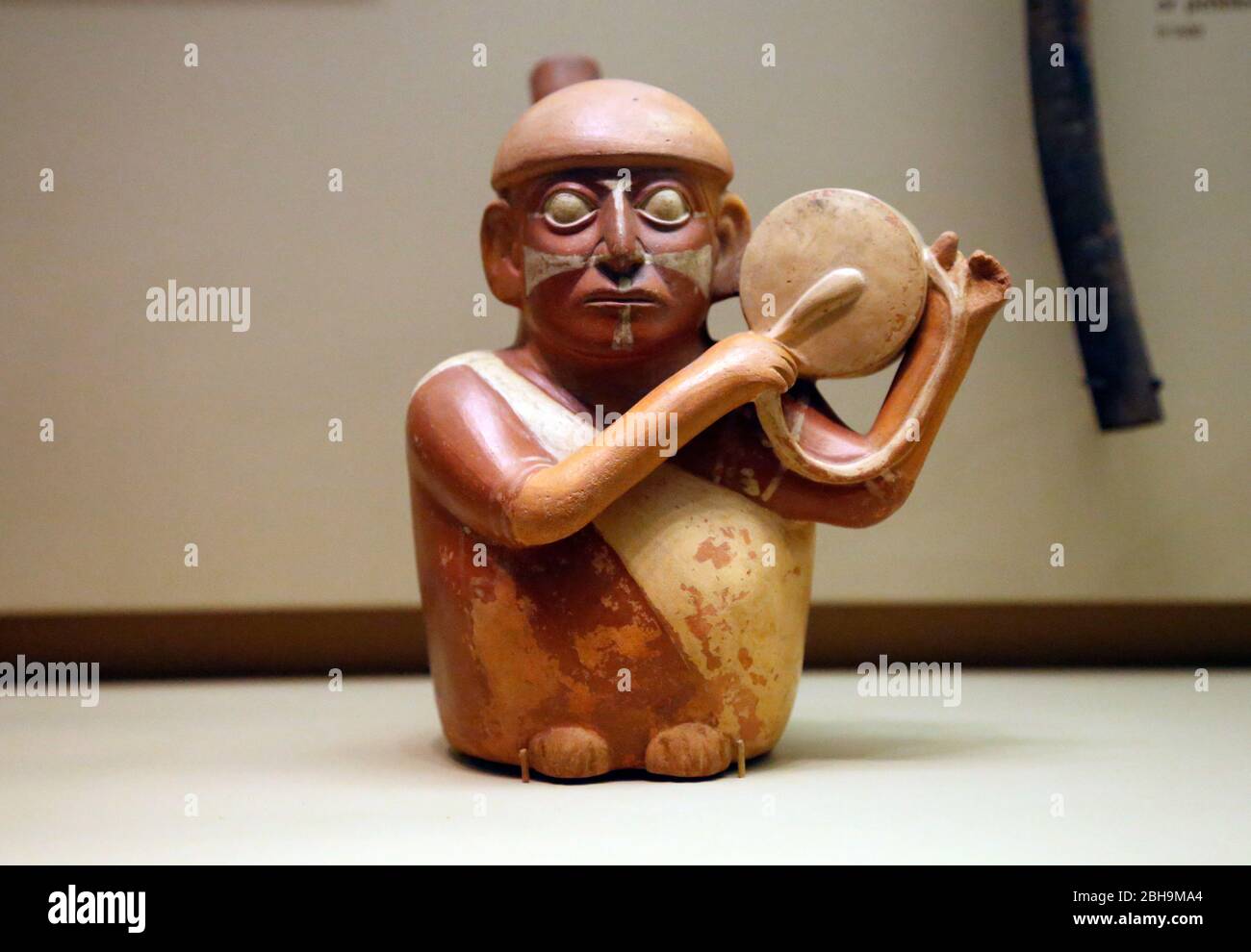 Pre-Columbian era. Stirrup-spout ceramic bottle in form of men playing musical instrument. Moche. Peru. South Americal Stock Photo