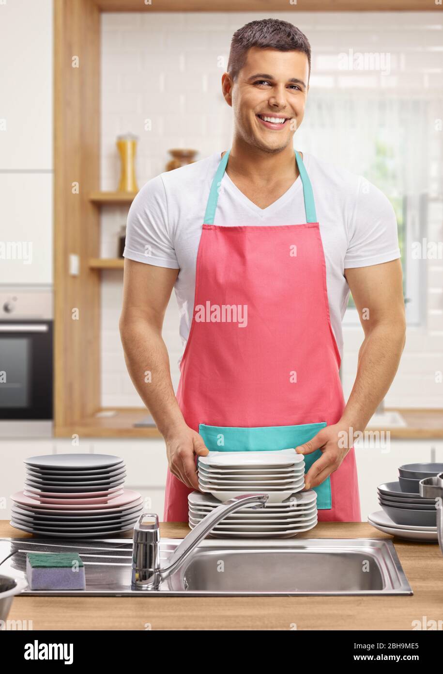 Man wearing apron cooking hi-res stock photography and images - Alamy