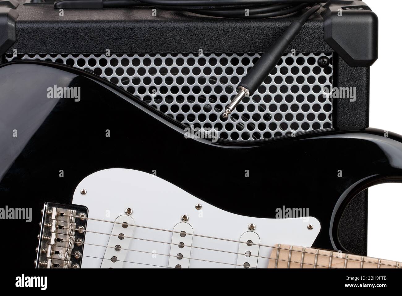 Guitar with amplifier and audio cord with jack closeup Stock Photo