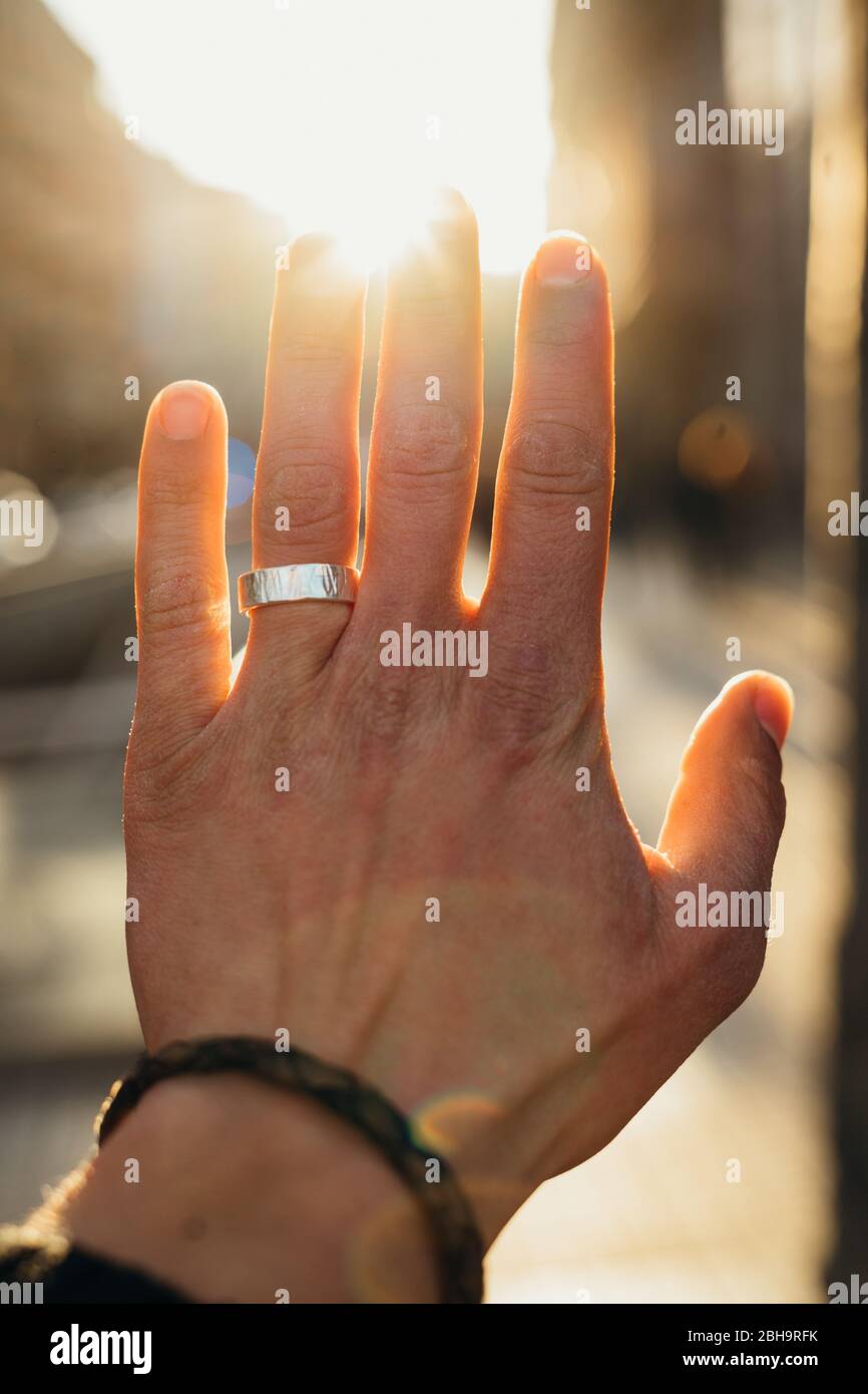 Beautiful hand with the ring and the sunlight Stock Photo