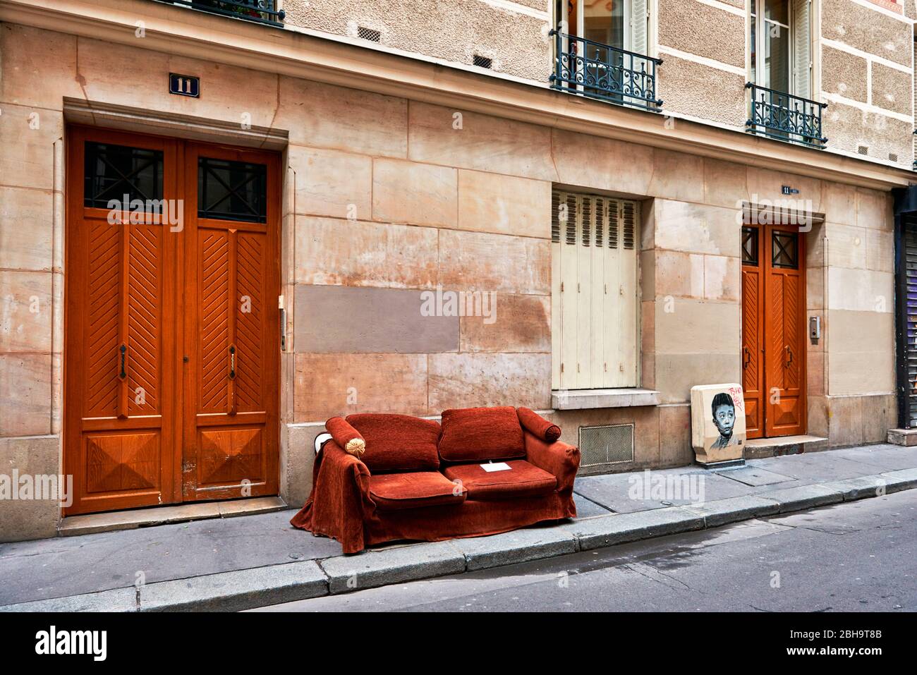 Sofa on the street in front of a building in Paris, France Stock Photo