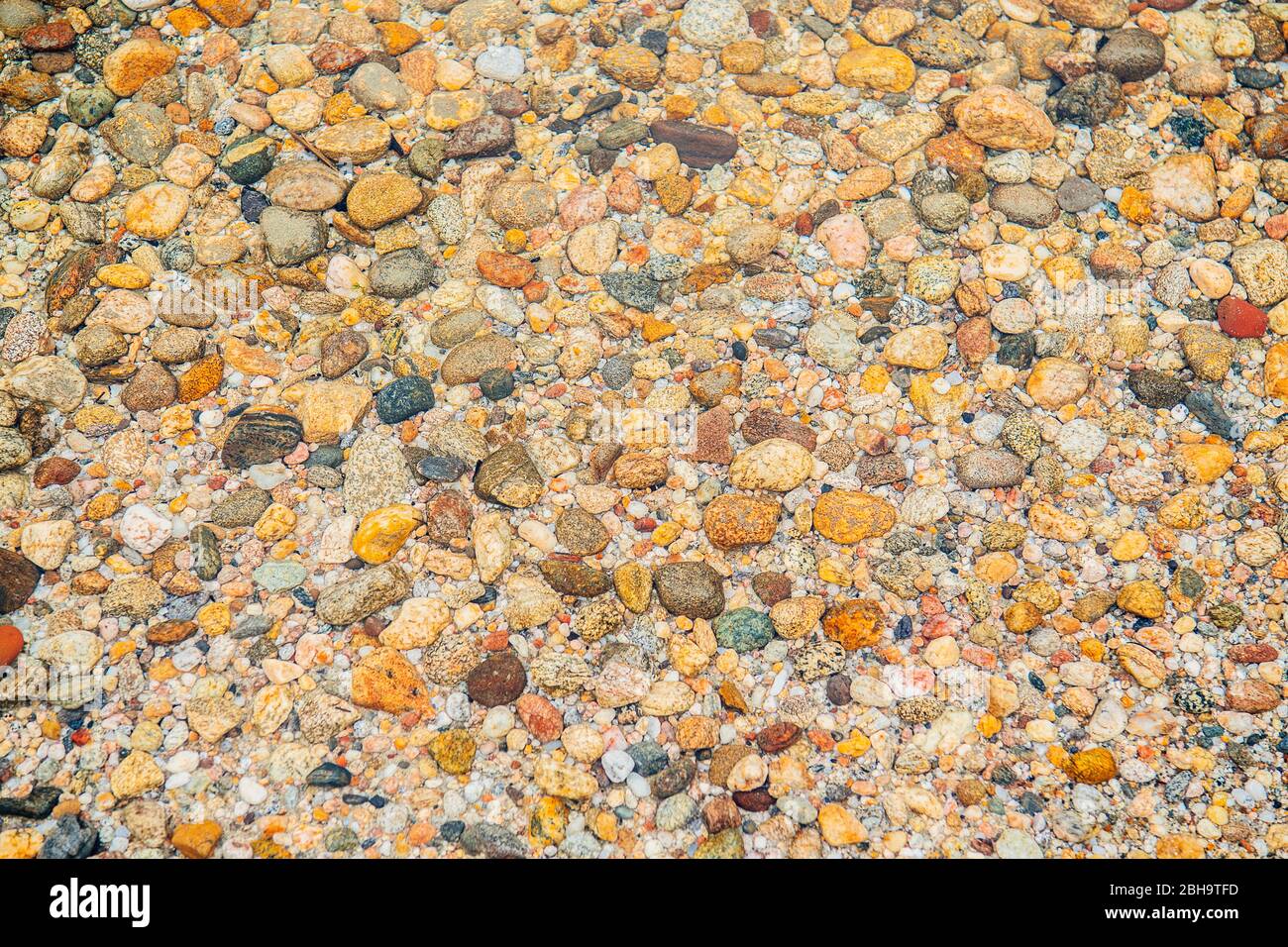 Close up of colorful stones at shoreline, Lake Wenatchee State Park, Wenatchee, Washington, USA Stock Photo