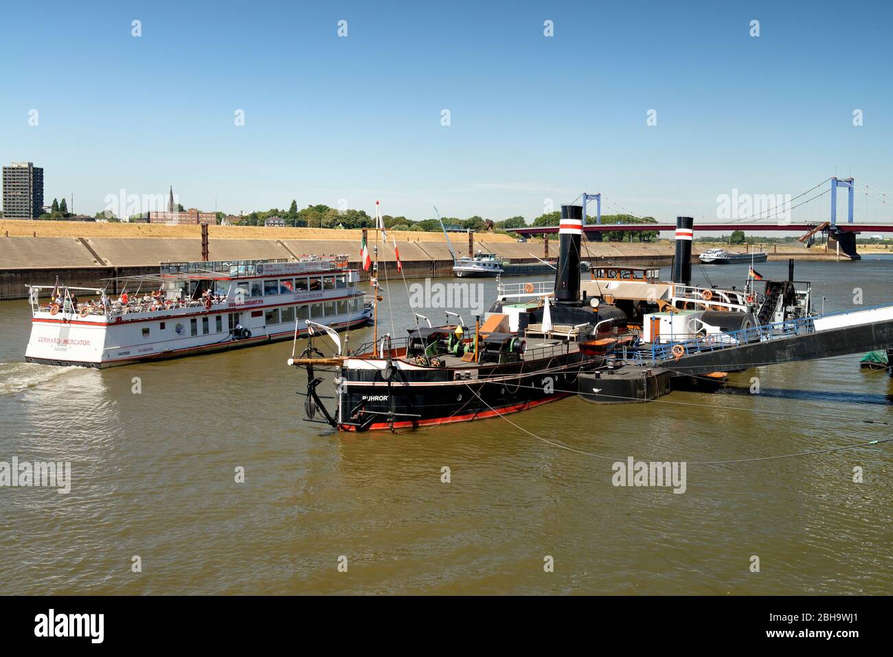 View of an excursion boat and the wheeled tug Oskar Huber, Museum Ship, Museum of German Inland Navigation, Duisburg-Ruhrort, Duisburg, North Rhine-Westphalia, Germany Stock Photo