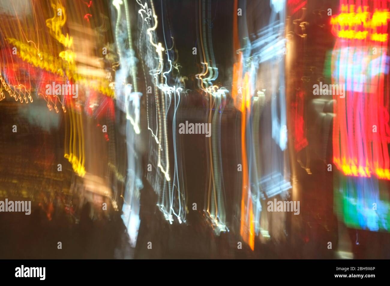 Time exposure of night club neons and illuminated bars at Avenida Cinquo in Playa del Carmen Mexico Stock Photo