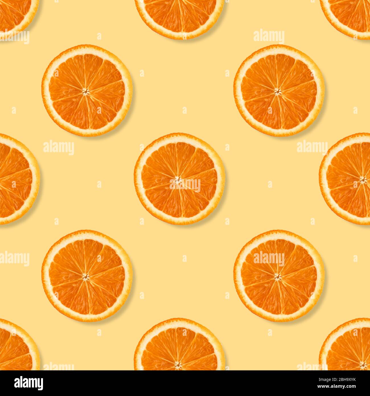Seamless pattern with real orange slices on pastel background for web ...