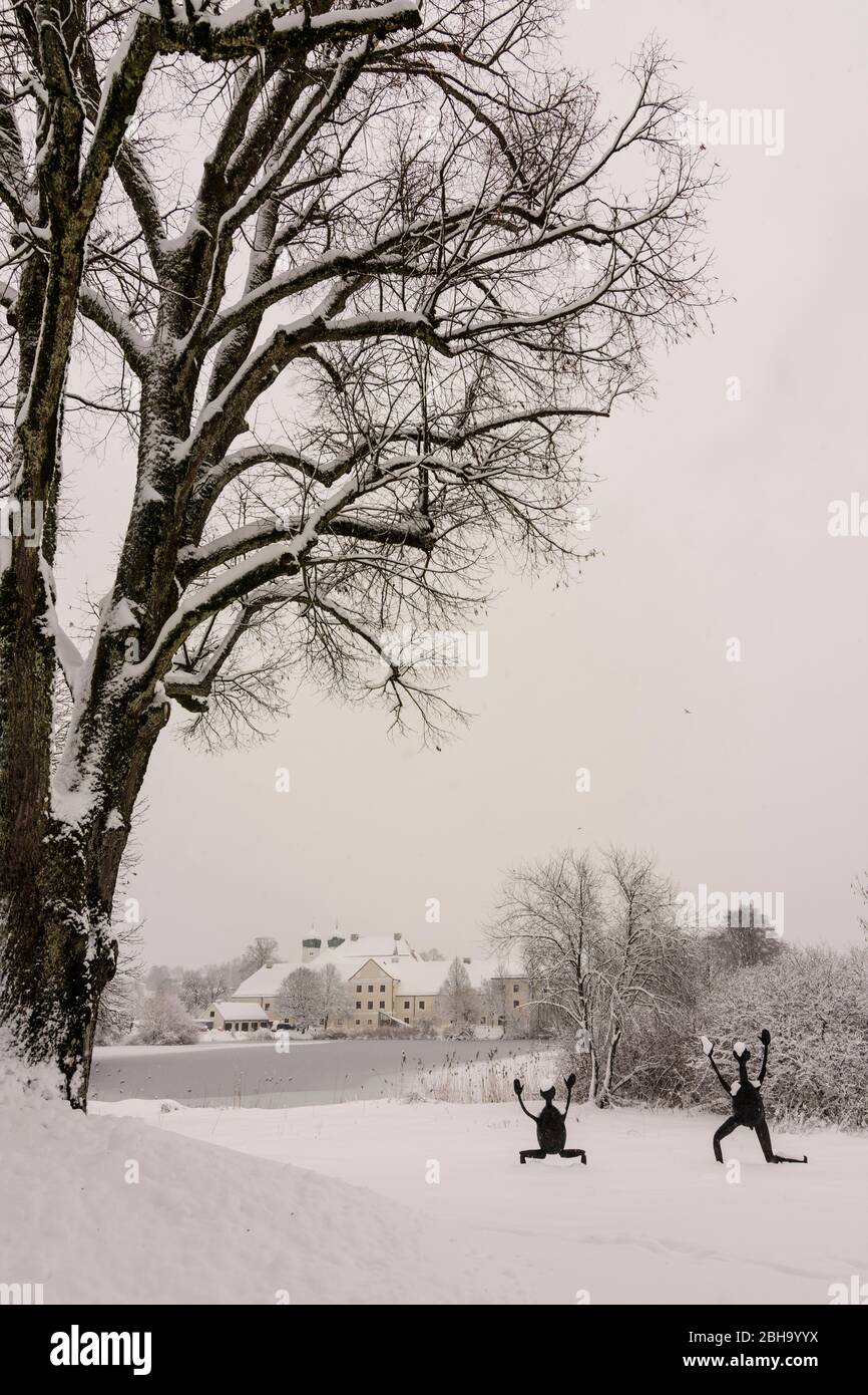 Seeon-Seebruck: Seeon Abbey, lake Klostersee, church Sankt Lambert, snow, artwork in Upper Bavaria, Chiemsee Alpenland, Upper Bavaria, Bavaria, Bavaria, Germany Stock Photo